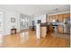 Bright kitchen with stainless appliances, wooden cabinets and table with seating and hardwood floors at 2244 Ashley Crossing Dr # 1232, Charleston, SC 29414