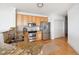 Updated kitchen boasting stainless steel appliances, granite countertops, and light wood cabinetry at 2244 Ashley Crossing Dr # 1232, Charleston, SC 29414