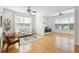 Bright and open living room with modern furniture, hardwood floors and two bright windows with an open feel at 2244 Ashley Crossing Dr # 1232, Charleston, SC 29414