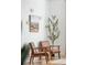 Cozy living room with stylish furniture, decorative wall art, and a lush indoor tree, enhancing the ambiance at 2244 Ashley Crossing Dr # 1232, Charleston, SC 29414