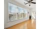 Bright living room featuring large windows, hardwood floors, and a neutral color palette at 2244 Ashley Crossing Dr # 1232, Charleston, SC 29414