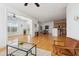 Open-concept living room featuring hardwood floors connecting the living, dining, and kitchen areas at 2244 Ashley Crossing Dr # 1232, Charleston, SC 29414