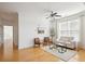 Bright living room with hardwood floors, neutral decor, and a ceiling fan for added comfort at 2244 Ashley Crossing Dr # 1232, Charleston, SC 29414