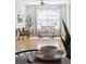 Inviting living room with neutral tones, hardwood floors, and abundant natural light, creating a warm ambiance at 2244 Ashley Crossing Dr # 1232, Charleston, SC 29414