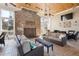 A covered lounge area offers comfortable seating around a brick fireplace and outdoor furniture for relaxation and entertainment at 2244 Ashley Crossing Dr # 1232, Charleston, SC 29414