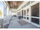 A covered patio area provides residents with a comfortable outdoor space with fans and lounge seating at 2244 Ashley Crossing Dr # 1232, Charleston, SC 29414
