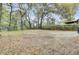 Wide view of backyard featuring mature trees and wooden fence at 2325 Sorentrue Ave, North Charleston, SC 29405