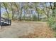 Large backyard with mature trees and a detached garage, offering plenty of space at 2325 Sorentrue Ave, North Charleston, SC 29405