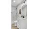 Modern bathroom with a marble tiled walk-in shower, black fixtures, and white vanity at 2325 Sorentrue Ave, North Charleston, SC 29405