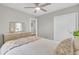 Bright bedroom featuring a ceiling fan, wood dresser with mirror, and a cozy bed at 2325 Sorentrue Ave, North Charleston, SC 29405