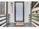 Charming front entrance with a white door, black accents, and a welcoming 'Hello' doormat at 2325 Sorentrue Ave, North Charleston, SC 29405