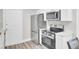 Updated kitchen featuring stainless steel appliances, white cabinets, and plenty of counter space at 2325 Sorentrue Ave, North Charleston, SC 29405