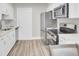 Modern kitchen with stainless steel appliances, white cabinets, and new flooring at 2325 Sorentrue Ave, North Charleston, SC 29405