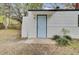 The back door of the house featuring a light blue door and siding at 2916 Louise Dr, North Charleston, SC 29405