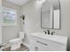 Bathroom featuring white vanity, black faucet, and modern mirror at 2916 Louise Dr, North Charleston, SC 29405