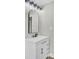 The vanity offers a modern sink, mirror, and lighting at 2916 Louise Dr, North Charleston, SC 29405