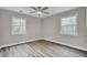 This bedroom offers neutral colors, recessed lighting, and wood-look floors at 2916 Louise Dr, North Charleston, SC 29405