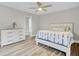 This bedroom offers neutral colors, recessed lighting, and wood-look floors at 2916 Louise Dr, North Charleston, SC 29405