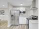 The kitchen offers stainless steel appliances and white cabinets with modern countertops at 2916 Louise Dr, North Charleston, SC 29405