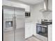This bright kitchen offers stainless steel appliances and white cabinets with modern countertops at 2916 Louise Dr, North Charleston, SC 29405