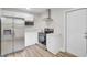Modern kitchen with stainless steel appliances, white cabinets, stainless steel refrigerator and updated countertops at 2916 Louise Dr, North Charleston, SC 29405