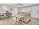 Bright living room featuring modern flooring, neutral paint, and a dining area at 2916 Louise Dr, North Charleston, SC 29405