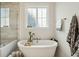 A serene bathroom showcasing a freestanding tub, decorative details, and natural light, ideal for relaxation at 2951 Clearwater Dr, Mount Pleasant, SC 29466