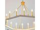 A stylish chandelier featuring a gold and wood finish adds elegance to any living space at 2951 Clearwater Dr, Mount Pleasant, SC 29466