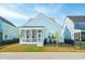 Beautiful home featuring a screened-in porch, blue siding, and manicured landscaping at 2951 Clearwater Dr, Mount Pleasant, SC 29466
