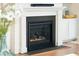 Cozy fireplace with a white mantel and black surround, flanked by built-in shelving at 2951 Clearwater Dr, Mount Pleasant, SC 29466