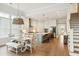 Spacious kitchen with stainless steel appliances, an island with seating, and hardwood flooring throughout at 2951 Clearwater Dr, Mount Pleasant, SC 29466