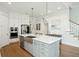 Bright, modern kitchen with stainless steel appliances, a large island, and hardwood floors at 2951 Clearwater Dr, Mount Pleasant, SC 29466