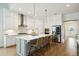 Well-equipped kitchen with stainless steel appliances, white cabinets, and a spacious island at 2951 Clearwater Dr, Mount Pleasant, SC 29466