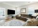 Comfortable living room featuring a sectional couch, large television, and stylish decor at 2951 Clearwater Dr, Mount Pleasant, SC 29466