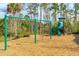 Fun playground with swings and a slide set, nestled among tall trees and offering a safe play area for children at 2951 Clearwater Dr, Mount Pleasant, SC 29466
