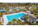 An aerial view of a large, inviting community pool with tennis courts nearby and lots of lounge chairs at 2951 Clearwater Dr, Mount Pleasant, SC 29466