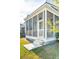 Charming screened-in porch with a ceiling fan and a welcoming entrance from the yard at 2951 Clearwater Dr, Mount Pleasant, SC 29466