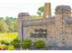 Elegant brick sign at the entrance to 'The Club at Dunes West' welcomes residents and guests at 2951 Clearwater Dr, Mount Pleasant, SC 29466