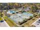 A community's tennis courts and pool area with several players and many parked cars on a sunny day at 2951 Clearwater Dr, Mount Pleasant, SC 29466