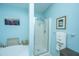 Well-lit bathroom featuring a glass-enclosed shower, soaking tub, decor, and towels on a towel rack at 2952 Sweetleaf Ln, Johns Island, SC 29455