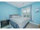 Well-lit bedroom with natural light, a comfortable bed, and decor, providing a cozy retreat at 2952 Sweetleaf Ln, Johns Island, SC 29455