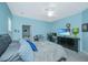 Bedroom with ceiling fan, TV, and an adjacent bathroom, creating a comfortable and private space at 2952 Sweetleaf Ln, Johns Island, SC 29455