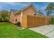 Home exterior with a wooden fence and neatly trimmed lawn at 2952 Sweetleaf Ln, Johns Island, SC 29455