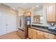 Bright kitchen features stainless steel appliances, granite countertops and open view to dining area at 2952 Sweetleaf Ln, Johns Island, SC 29455