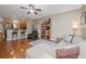 Spacious living room featuring hardwood floors, comfortable seating, and view to kitchen at 2952 Sweetleaf Ln, Johns Island, SC 29455