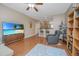 Living room with hardwood floors and modern furnishings, TV and view to kitchen at 2952 Sweetleaf Ln, Johns Island, SC 29455