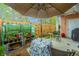 Charming outdoor patio with greenhouse, table, and seating, perfect for enjoying the garden at 2952 Sweetleaf Ln, Johns Island, SC 29455