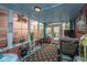 Bright sunroom with tile floor, overhead lighting and bright windows at 2952 Sweetleaf Ln, Johns Island, SC 29455