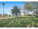 Expansive backyard featuring a lush green lawn, mature trees, and a secure fence for outdoor enjoyment at 3075 Maritime Forest Dr, Johns Island, SC 29455
