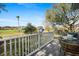 Relaxing balcony area with seating overlooking lush green space and trees at 3075 Maritime Forest Dr, Johns Island, SC 29455